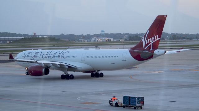 Airbus A330-300 (G-VINE) - This is from the Skydeck at the Concourse F Sky Club.  Its a nice place for spotting but the reflections from the glass are just brutal.