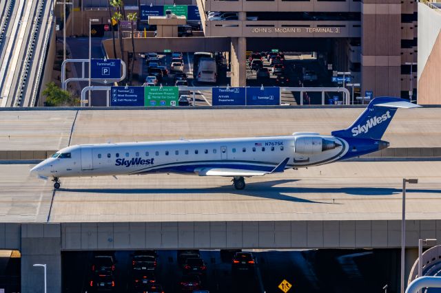 Canadair Regional Jet CRJ-700 (N767SK) - A SkyWest CRJ700 taxiing at PHX on 2/9/23 during the Super Bowl rush. Taken with a Canon R7 and Tamron 70-200 G2 lens.