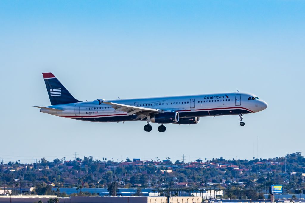 Airbus A321 (N578UW) - An American Airlines A321 in US Airways retro livery landing at PHX on 2/4/23. Taken with a Canon R7 and Tamron 70-200 G2 lens.