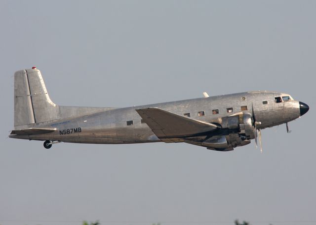 Douglas VC-117 (N587MB) - N587MB Super DC-3 DC-3S/C-117D/R4D-8 taking off of runway 9L at KOPF.  Photo credits Keith Burton.