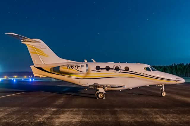 Beechcraft Premier 1 (N67FP) - On the ramp under a starry night at KOCH.