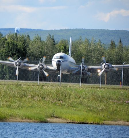 Douglas DC-6 — - Taxiing onto the active.