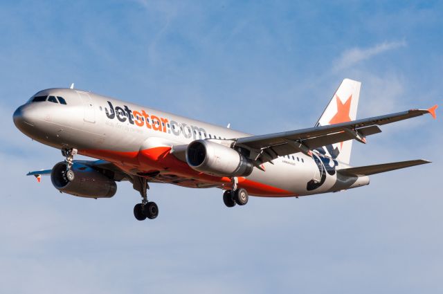 Airbus A320 (VH-VGI) - Jetstar flight JST237 from Auckland in the final 150ft of landing at Christchurch Airport on 5 March 2016, just after 6pm. Photographed with my 300mm telephoto lens from the side of Pound Rd looking south.