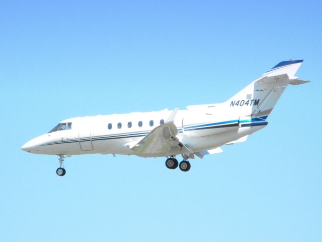 Hawker 800 (N404TM) - This Twin Engine Business Jet is shown here on final in the Spring of 2013.