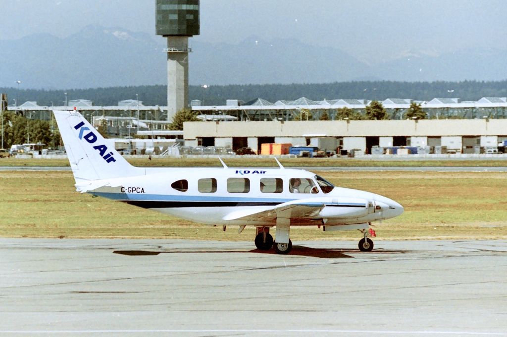Piper Navajo (C-GPCA) - CYVR - noon  departure for KD Air at Vancouver, leaving the old south terminal ramp for the runway. photo day date apprx August 1997-98.