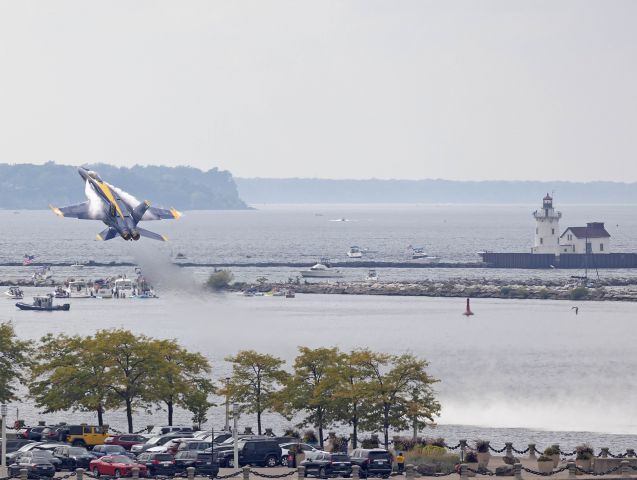 McDonnell Douglas FA-18 Hornet (16-5665) - US Navy Blue Angel 6, Opposing Solo, kicking up a little vape and water near Voinovich Park on day one of the Cleveland National Airshow Saturday afternoon, 3 Sep 2022. This was the Blue’s first performance in Cleveland with the new Boeing F-18 Super Hornet.