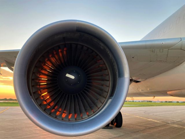 Airbus A300F4-600 (N728FD) - The starboard engine of an A306 (GE CF6 turbofan) at ATW glows impressively as the setting sun  illuminates the engine from the exhaust nozzle to the fan blades. 