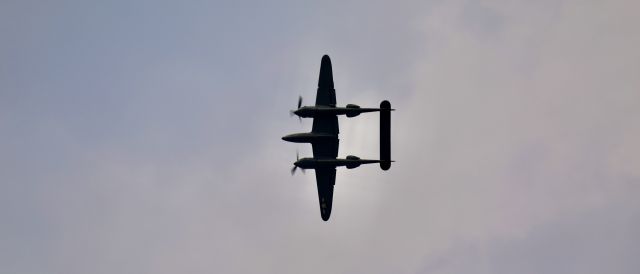 Lockheed P-38 Lightning (N79123) - EAA 2021. Photo taken mid-break for landing 27. 