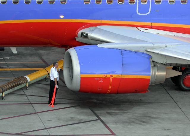 Boeing 737-700 (N224WN) - Completing a his pre-flight check. 