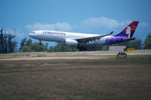 Airbus A330-200 — - Hawaiian A330-200 about to smoke the mains on runway 8L at PHNL.