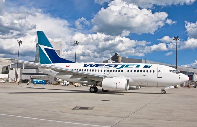 BOEING 737-600 (C-GWSL) - Welcome to Boston - WestJet !