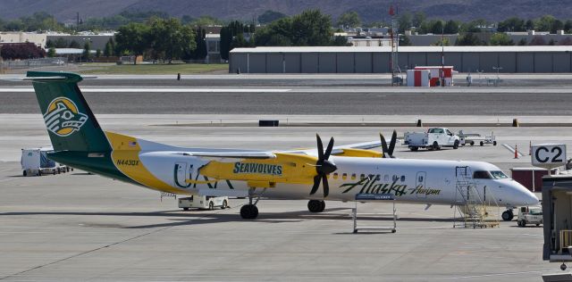 de Havilland Dash 8-400 (N443QX) - Horizon Airs University of Alaska Anchorage "Seawolves" college-livery (N443QX) is being prepped for pushback in this late morning shot.  The primary use of this QXE fleetbird is for runs between Anchorage and Fairbanks so this sighting of it at Reno Tahoe International was an unusual bit of good fortune.