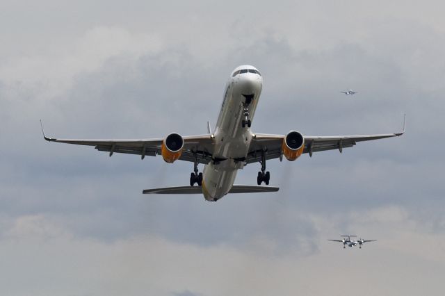 BOEING 757-300 (D-ABOH) - CFG1482 departs for Fuertaventura as 2 other planes are on approach behind.  The cross wind was a bit strong.