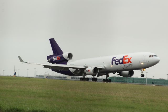 Boeing MD-11 (N617FE) - A FedEx McDonnell Douglas MD-11F landing on runway 22 at London Stansted Airport.br /br /Location: London Stansted Airport.br /Date: 12.10.22 (dd/mm/yy).