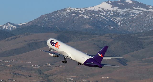 BOEING 767-300 (N180FE) - Fed Ex's "Kristjan," a B763 (N180FE), is off 17R at half past 6 in the morning and on the climb past Mt. Rose for a brief 30 minute flight. 