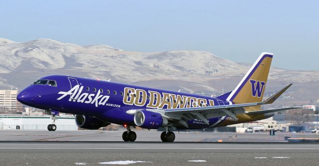 Embraer 175 (N662QX) - QXE's University of Washington "Huskies" collegiate "GO DAWGS" livery plants the mains down on 17L to complete the first half of a morning SEA-RNO-SEA round trip run.