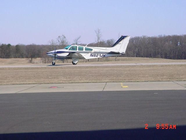 Beechcraft 55 Baron (N821JK) - Taxiing to ramp on 3/2/09
