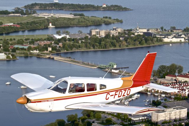 Piper Cherokee (C-FDZO) - Cherokee Arrow makes a trip late in the day past the historic LaSalle Causeway and Fort Henry World Heritage site in Kingston, Ontario - June 2013