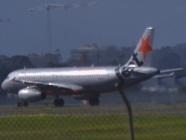 Airbus A320 (VH-VQM) - Just landed on runway 23 and on taxiway heading for gate at Terminal 1.