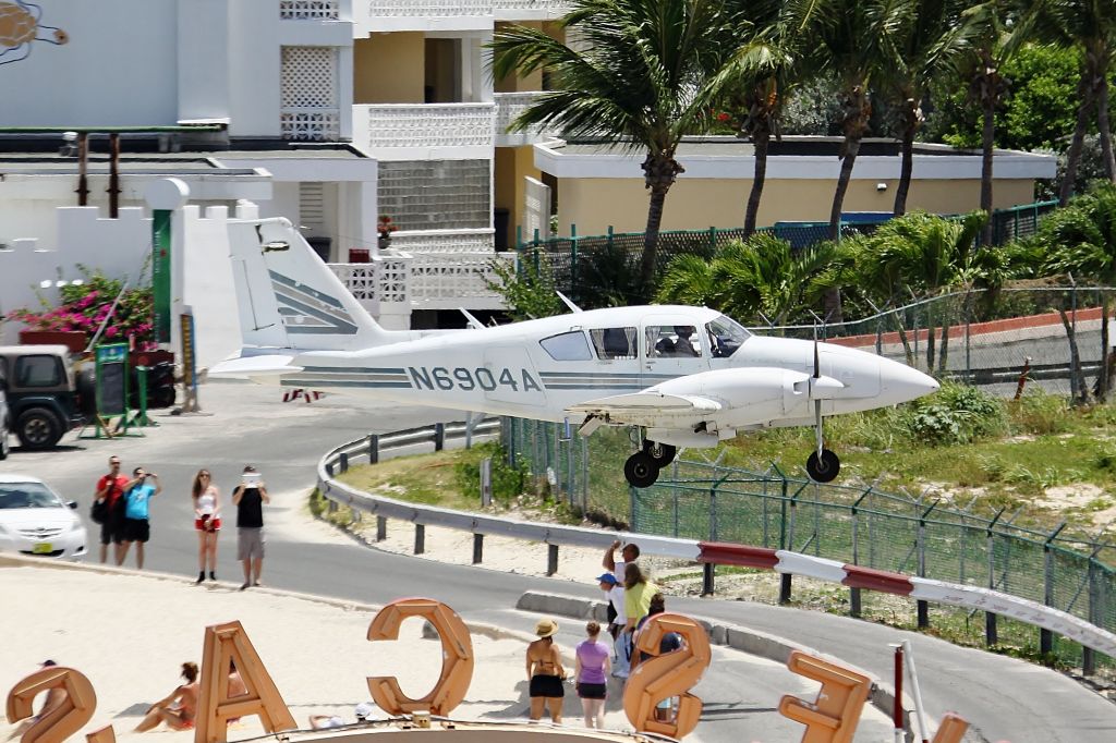 Piper Aztec (N6904A) - N6904A over maho beach on St Maarten