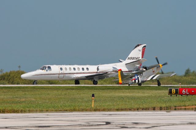 Cessna Citation V (N981AG) - A Titan T51 Mustang “Camel Smoker” gives way to an Aitheras Air Medical Group/Cleveland Clinic Critical Transport Citation arriving on RWY 24R during the 2015 Cleveland National Air Show on 6 Sep 2015. 