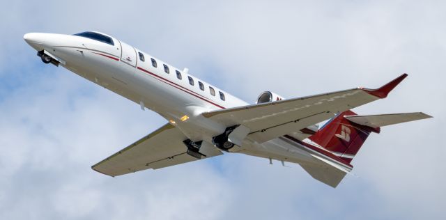 Learjet 45 (N984BH) - departing runway 23