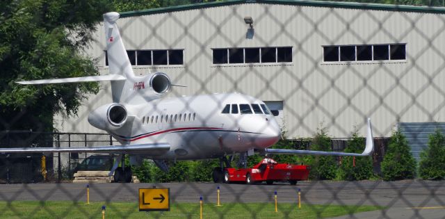 Dassault Falcon 900 (VP-BFM) - MORRISTOWN, NEW JERSEY, USA-AUGUST 28, 2018: Seen on the ground behind the fence line was this very nice looking plane.