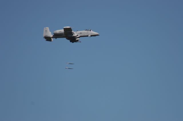 — — - Twin 500 Pounders Drop Toward a Simulated Enemy Convoy at Hardwood Range