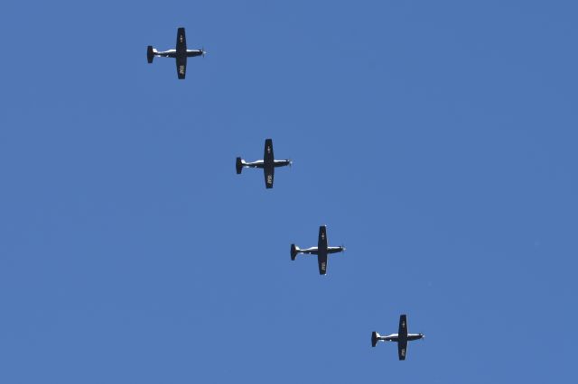 Raytheon Texan 2 — - Four ship formation of T-6A II's arriving over the top of IND 11-12-23. Arriving 5-R. I estimate  that they were approximately 1500-2000 AGL here. Zoomed out all the way and cropped down quite a bit.