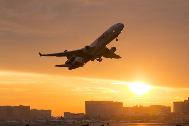 Boeing MD-11 (N522FE) - Morning take off from runway 25R from LAX. Los Angeles International Airport, California USA 