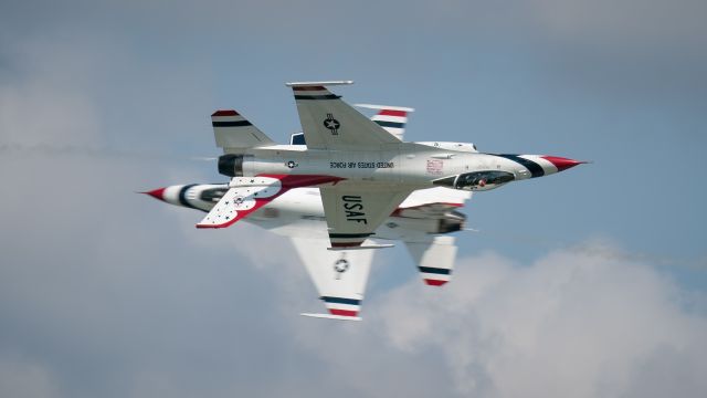 Lockheed F-16 Fighting Falcon — - The USAF Thunderbirds, executing an Opposing Knife Edge maneuver at the KC Airshow in Gardner, Kansas.