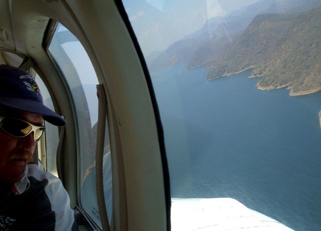 Beechcraft Baron (58) (ZS-JPE) - Over the Cahora Bassa dam, Mozambique.