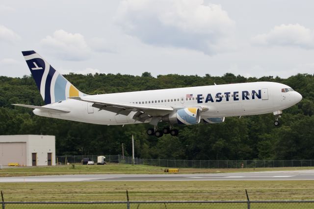 BOEING 767-200 (N605KW) - (8/3/21) N605KW over the numbers at BED, operating a military charter from AEX