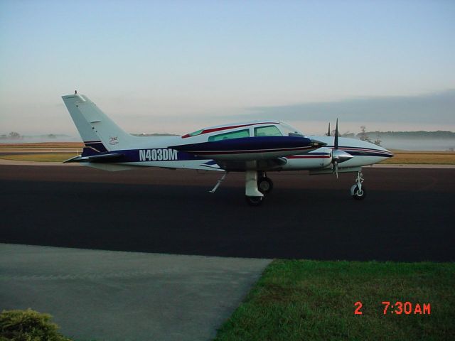 Cessna 310 (N403DM) - Parked on ramp in morning @ KHNB