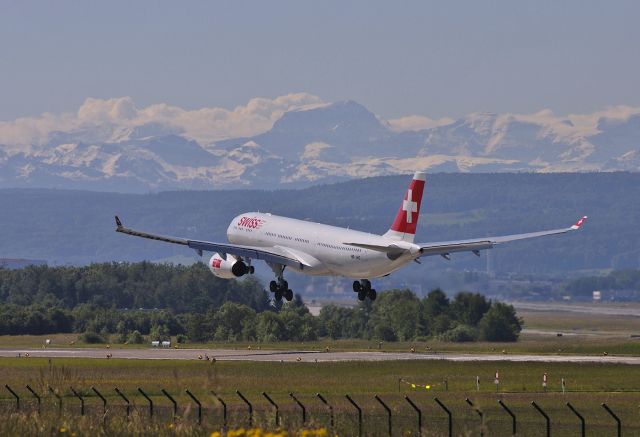 Airbus A330-200 (HB-JHG) - Landing on Runway 14 at Zurich Airport.