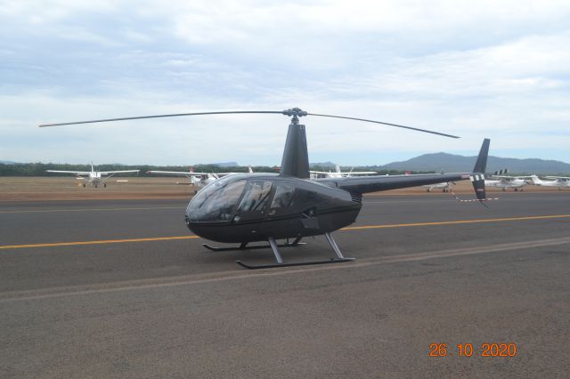 Robinson R-44 (VH-OXO) - parked on completion of maintenance at Mareeba. The registration is VH-OXO which is hardly visible and not contrasting. 