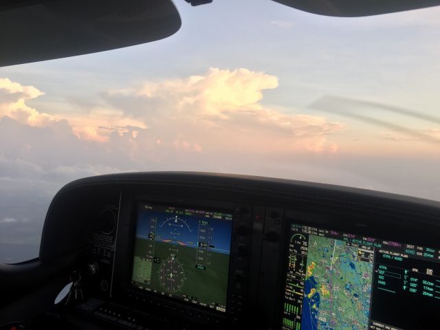 Cirrus SR-22 (N787LC) - Shooting the gap between Thunderstorms, look at the WAAS on the G1000