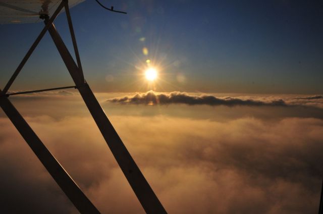 — — - Sun just about to set out the window of an antique Cessna 140 over Huntsville, AL.