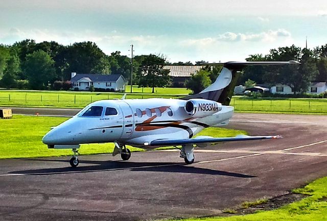 Embraer Phenom 100 (N933MA) - Photo made at Lebanon Municipal Airport at runway 19. (old Cell phone pic)