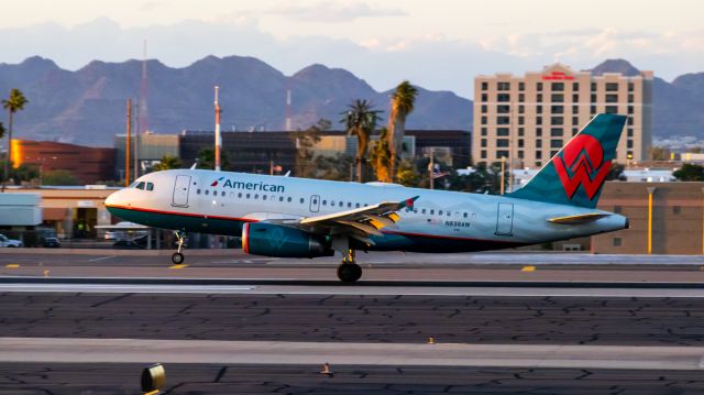 Airbus A319 (N838AW) - American Airlines A319 painted in America West retro livery landing at PHX on 3/6/2022. Taken with a Canon 850D and Canon 75-300mm lens.