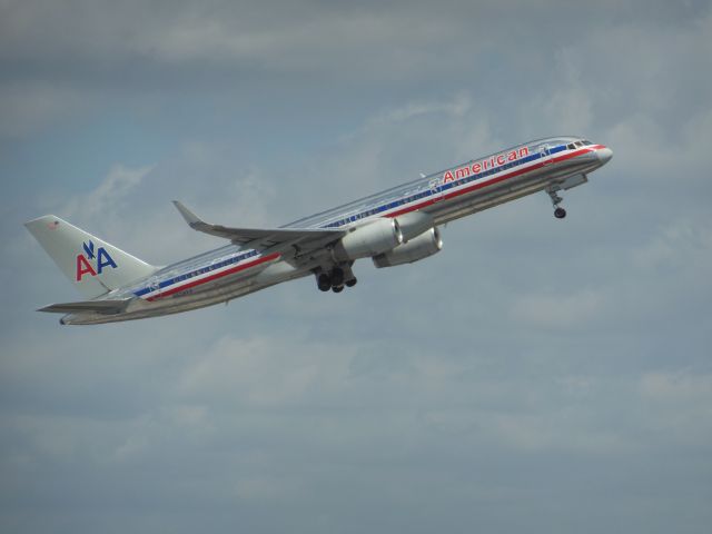 Boeing 757-200 (N604AA) - American Airlines (AA) N604AA B757-223 [cn27055]br /Miami (MIA). American Airlines flight AA935 departing for Puerto Plata (POP). This classic bare metal livery, first deployed in the late 1960’s was replaced by a new white livery in 2013 following the merger with US Airways. After completing 21273 cycles this aircraft’s last revenue flight was in March 2015, since when it has been stored at Roswell (ROS).br /Taken from Dolphin Car Park, Floor 6 (roof) by Terminal D entrancebr /2013 04 08  a rel=nofollow href=http://alphayankee.smugmug.com/Airlines-and-Airliners-Portfolio/Airlines/AmericasAirlines/American-Airlines-AA/i-DB4jQBghttps://alphayankee.smugmug.com/Airlines-and-Airliners-Portfolio/Airlines/AmericasAirlines/American-Airlines-AA/i-DB4jQBg/a