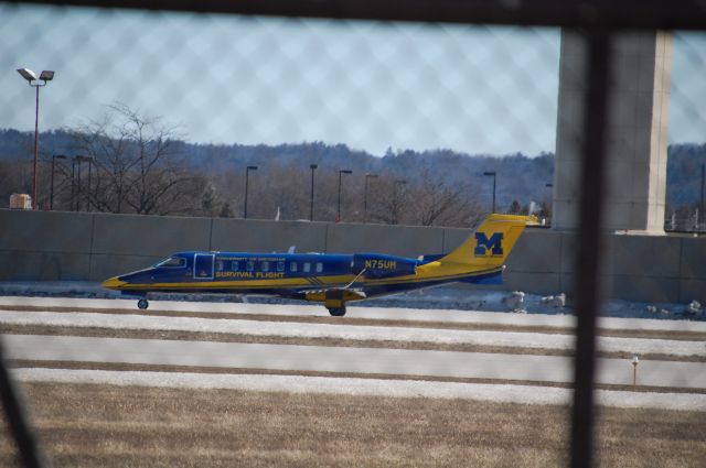 Bombardier Learjet 75 (N75UM) - N75UM has just landed at the Cherry Capital Airport