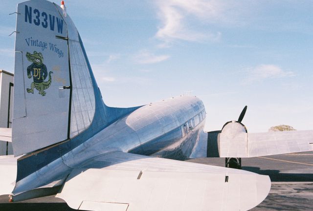 Douglas DC-3 (N33VW) - This C-47 was built as a Douglas C-47A-90-DL Skytrain, USAAF s/n 43-15935, msn 20401. It was declared surplus in 1946 according to Joe Baughers information. The aircraft went thru a succession of registrations and owners until 1998 when sold to Vintage Wings and Things of Carencro, Louisiana and registered as N33VW. It was sold to the Cavanaugh Flight Museum, Addison, Texas in 2009 and retains the FAA civil registration of N33VW. Photo was taken at KLFT, Lafayette Regional Airport, circa 2000. The aircraft has been repainted in a "WWII D-Day" livery, olive drab with light grey undersides and "invasion stripes" since this photo.