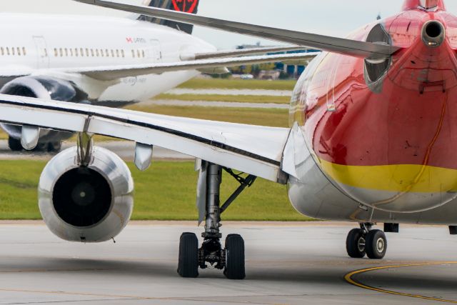 Airbus A330-200 (B-5963) - Look at the sidewall flex going on with the main gear tire as the fully loaded Airbus rounds the corner, and it's even putting some rubber down on the taxiway.