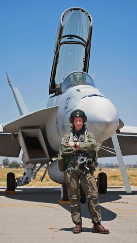 — — - Lt. Carrine Sweaty Cassady stands in front of her Boeing F/A-18F Super Hornet after a great demo flight @ KCNO during the Planes of Fame air show.