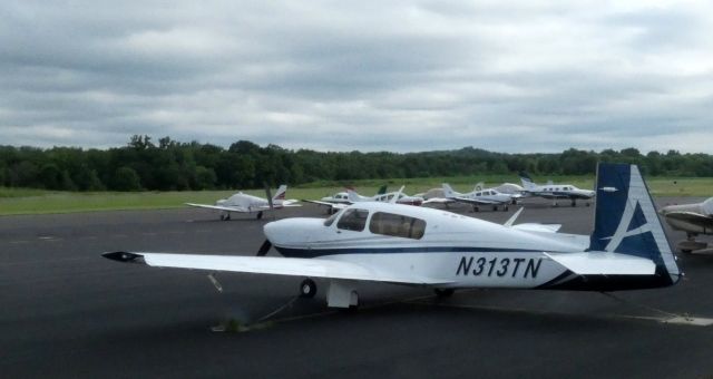 Mooney M-20 Turbo (N313TN) - Catching some tarmac time is this 2006 Mooney M-20TN in the Summer of 2021.