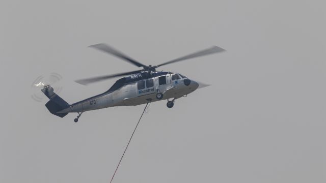 Sikorsky S-70 (N9FH) - Operating water bombing in heavy smoke near Yeppoon.