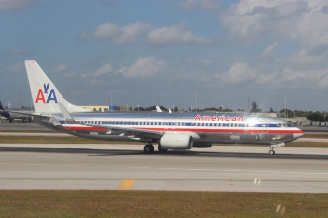 Boeing 737-800 (N907AN) - American 737 departing from runway 8R. Taken from our American Airlines Boeing 767-323ER, flight 1167, on November 29, 2012.