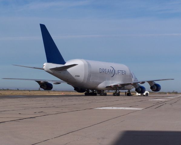 N780BA — - Dreamlifter being pushed out to the taxiway.