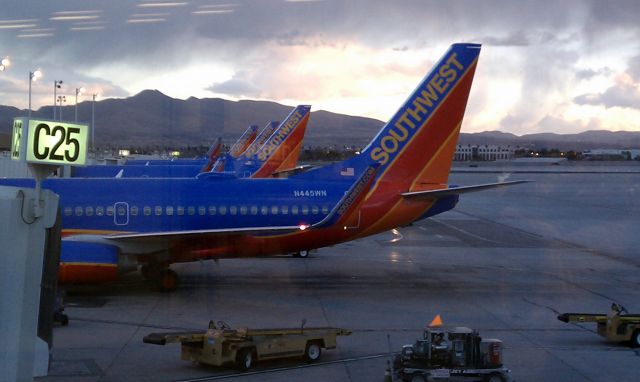 Boeing 737-700 (N455WN) - Leaving Las Vegas. A line of SWA B-737s await their passengers at dusk. The image just seemed to fit the mood as the flights out of Las Vegas are always so much more sedate than the arrivals.